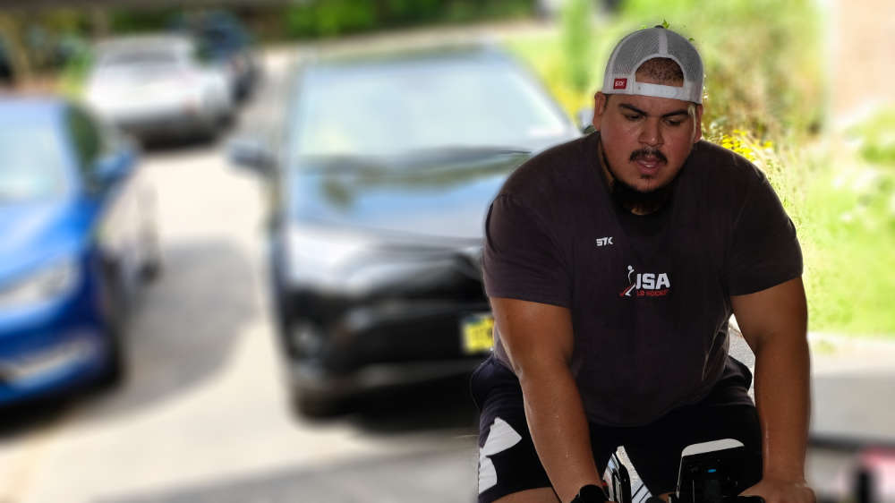 One of our trainers riding on an exercise bike in our gym